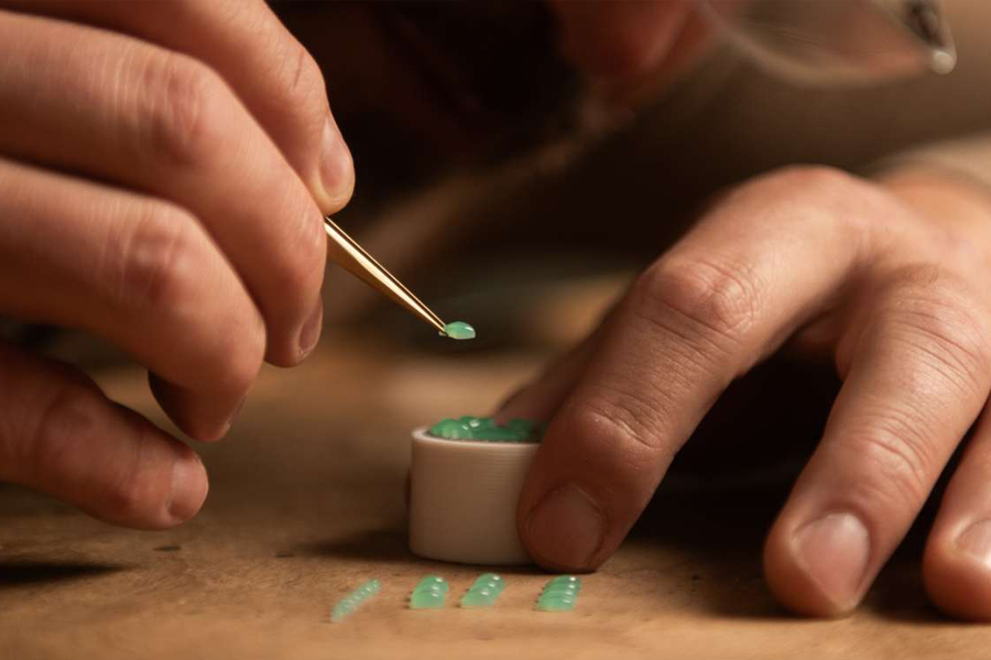 Alexandre Beauregard expertly setting hand-carved gemstone petalsjpg