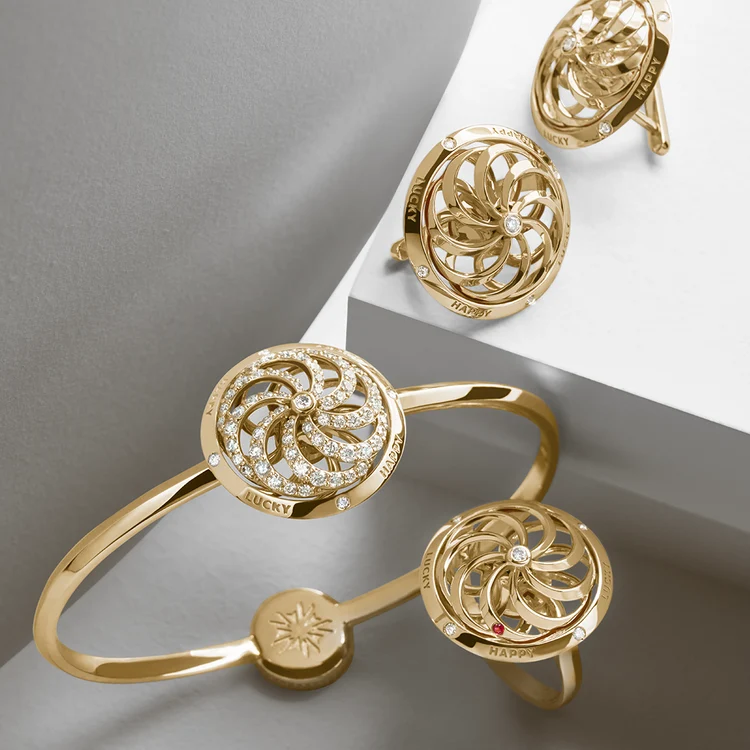 Three Sybarite Fortune Kinetic Rings and a matching bracelet