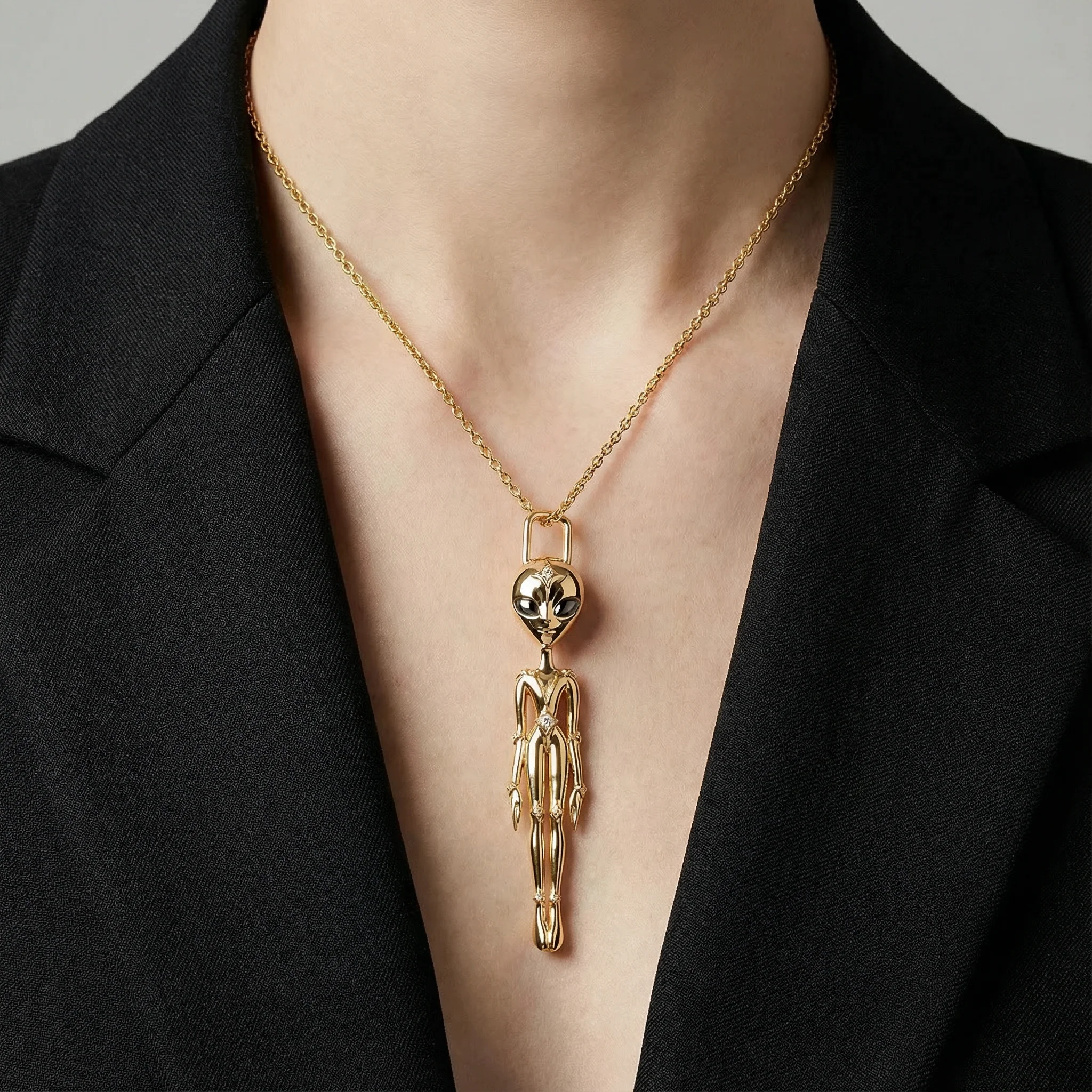 She's an Alien Pendant Necklace in 18KYG with sapphire eyes