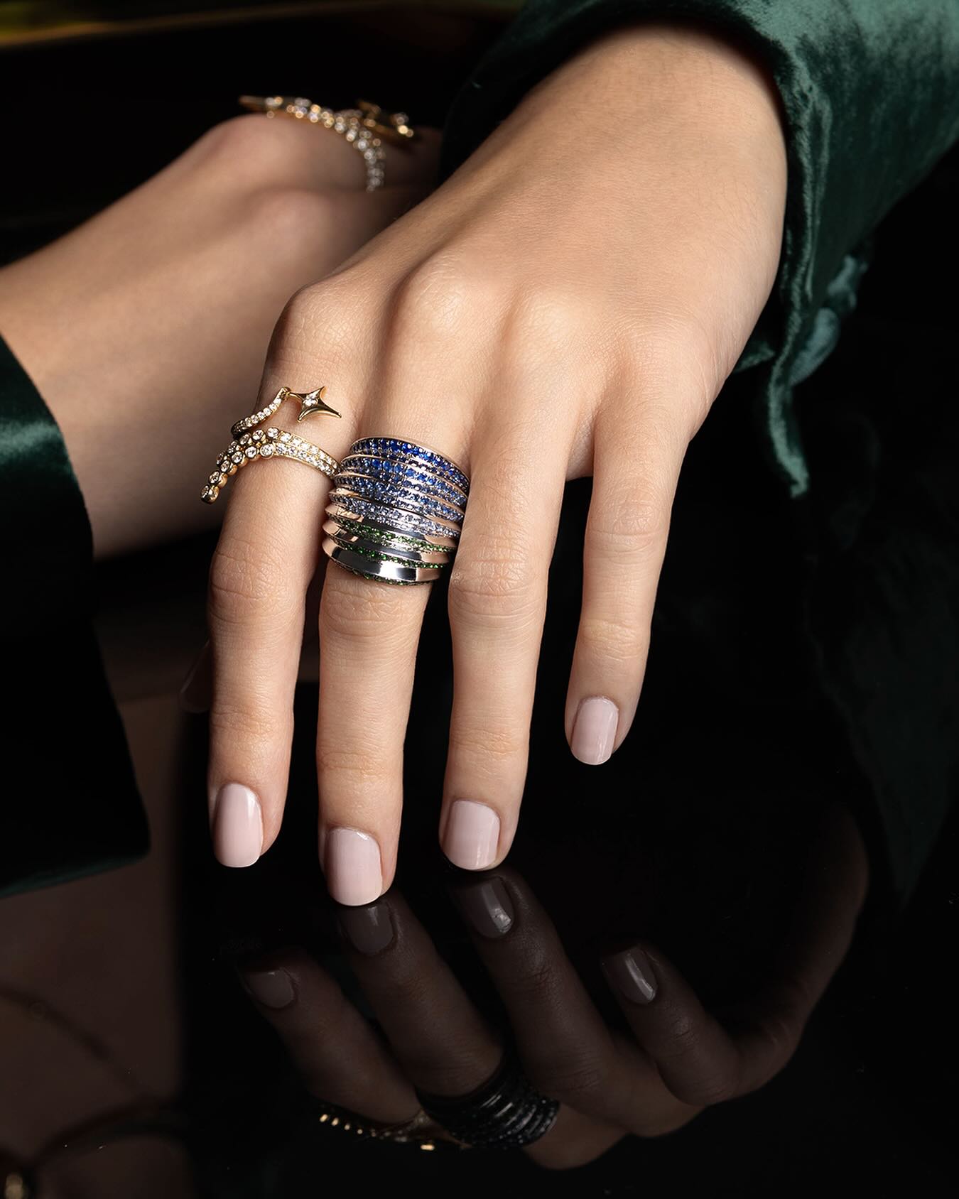 Sybarite Moonlight 18KWG Tsavorite & Sapphire Ring & Falling Star Ring on a model's hand
