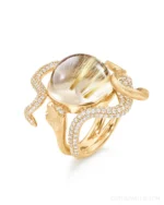 A serpent with secrets. 🐍 The Ole Lynggaard Snakes Ring coils around the finger in 18K yellow gold, glittering with pavé-set diamonds and crowned with an entrancing rutile quartz cabochon. Both sensual and symbolic, it’s a modern heirloom inspired by ancient mythology—a talisman of transformation, intuition, and fierce individuality.⁠
⁠