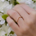Soft curves, radiant sparkle, and a whisper of romance—the Parade Design Lyria 18K rose gold curved diamond half band is made to contour perfectly with your engagement ring or stand alone with quiet confidence.⁠
⁠