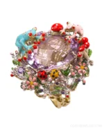 A whimsical garden at your fingertips 🌸🐸🐞💜⁠
⁠
The Santagostino Enamel Ladybug & Frog Ring is a miniature world of wonder.⁠
⁠
Delightful enamel ladybugs and vibrant frogs dance among jeweled flowers and golden leaves around a tranquil pond of amethyst.⁠
⁠
A true collector’s piece for lovers of artistry, color, and imagination.⁠
⁠